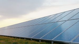 Power solar panels against blue sky background.